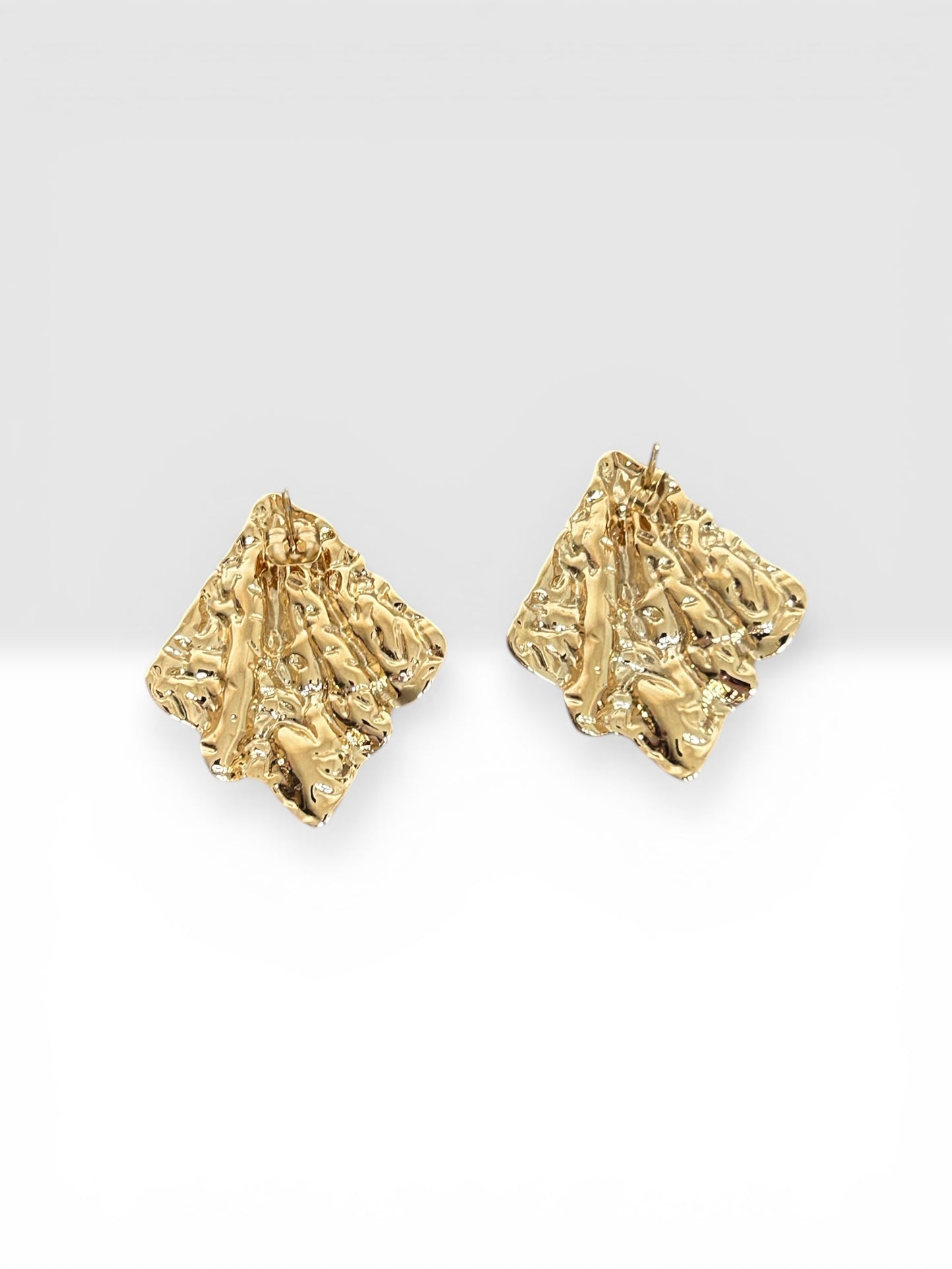 Boucles d’oreilles effet feuille dorée texturée